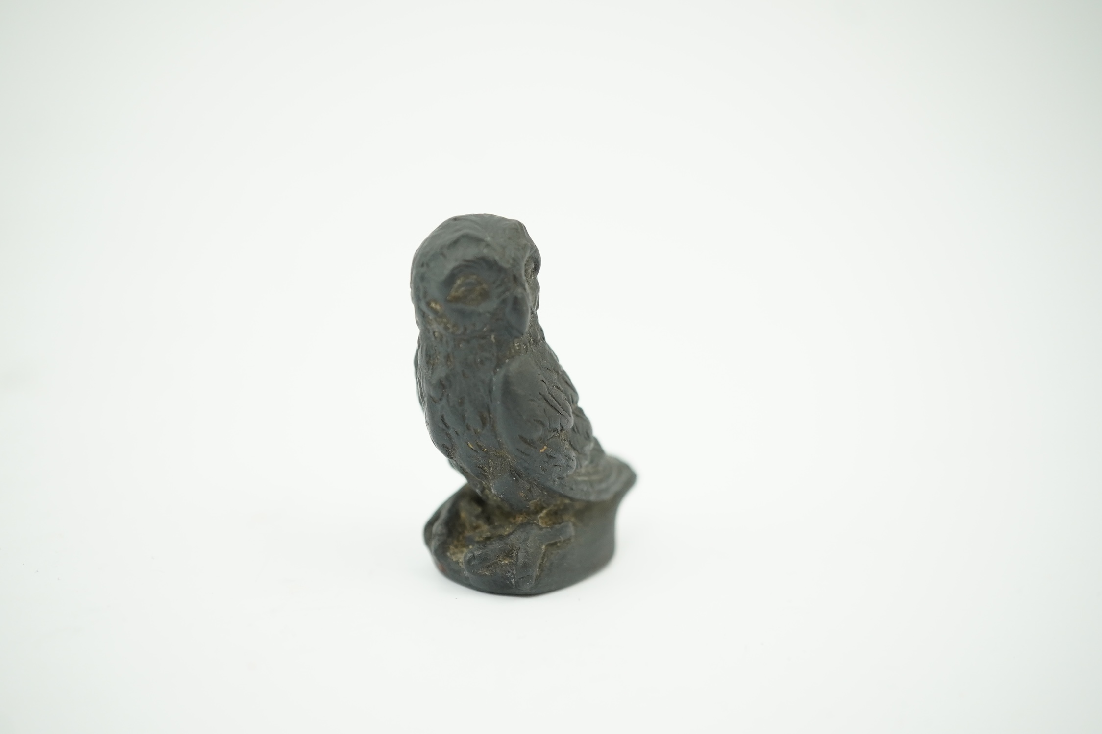 Attributed to Wedgwood, a black basalt intaglio fob seal, c.1809, modelled as an owl, inscribed ‘For further Particulars Enquire Within, 3.5cm high. Condition - good